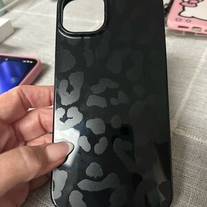 3 Apple iPhone 14 Plus cases.Black & Gray Leopard, Hello Kitty, Composition book